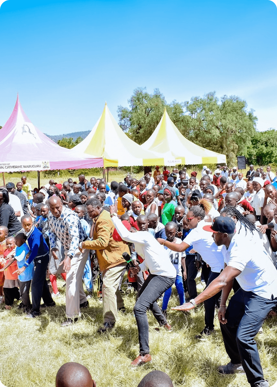 Wahome Foundation gathering under event tents