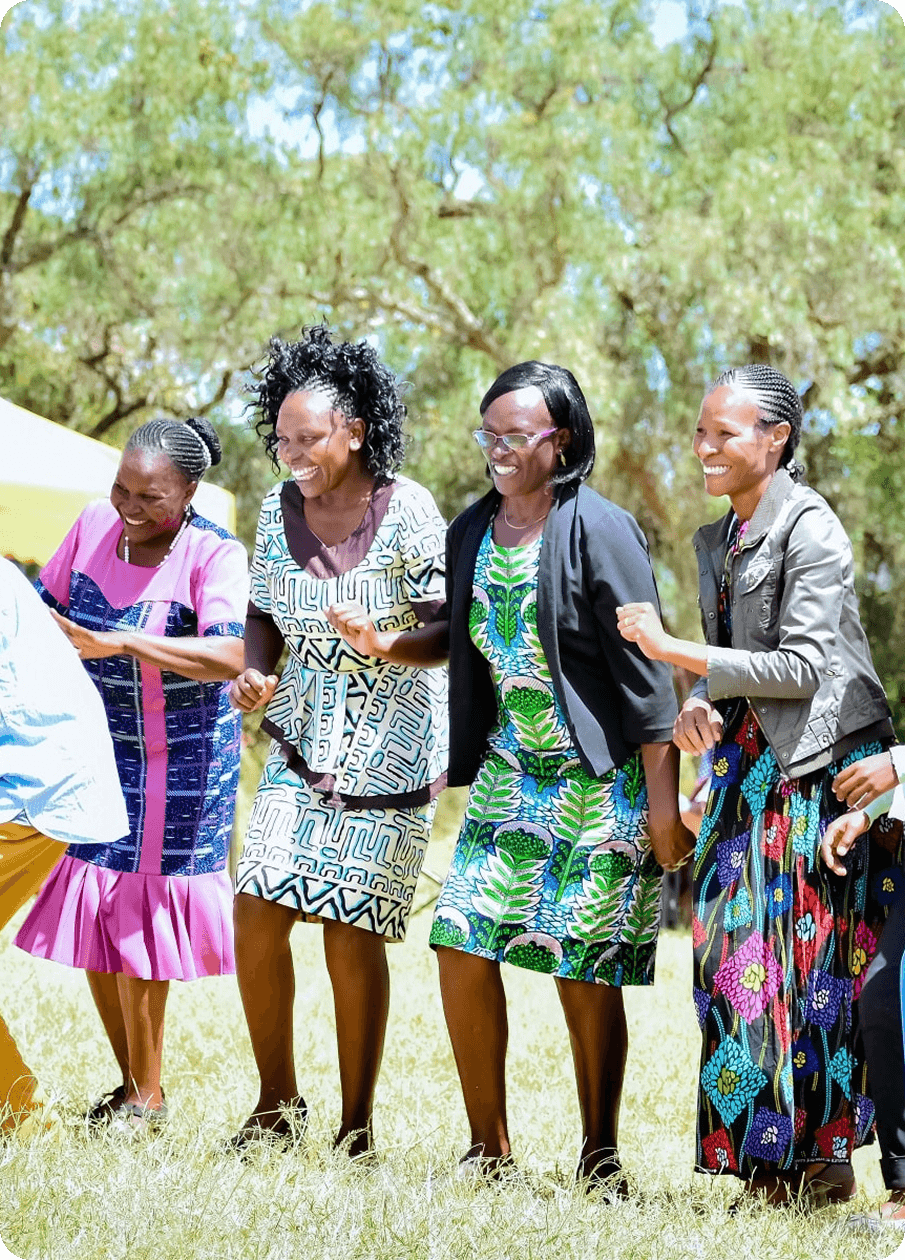 Children and volunteers celebrating at a Wahome Foundation event